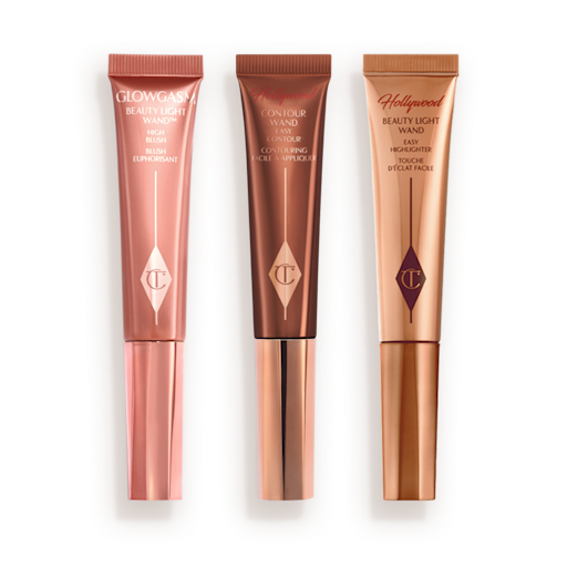 Medium-pink liquid blush wand, glowy brown contour wand, and soft candlelight-gold-coloured liquid highlighter wand.