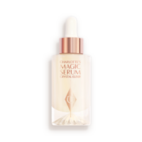 An award-winning, luminous, ivory-coloured serum in a glass bottle with a gold and white-coloured dropper lid.